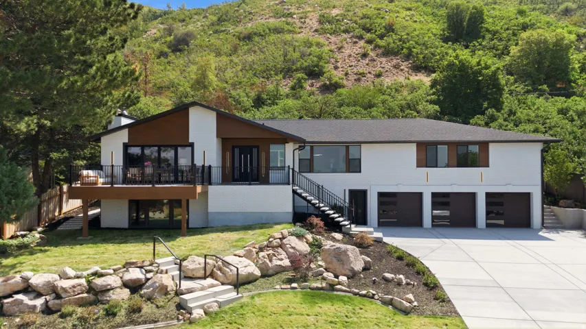 Contemporary exterior with white stucco and wood-finish siding