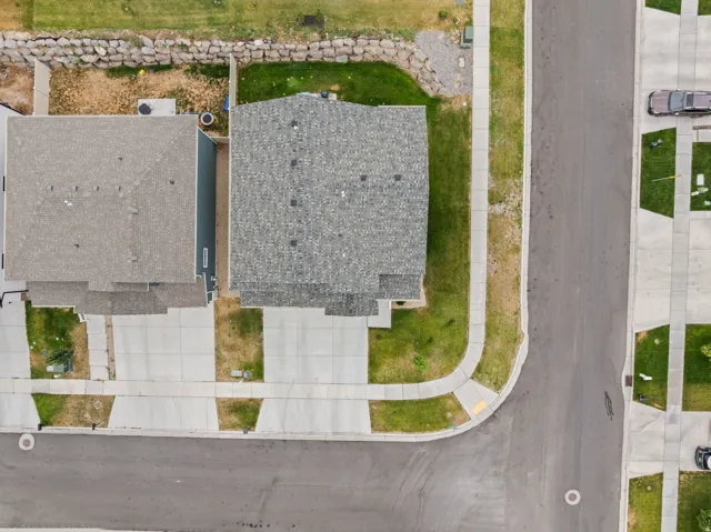Asphalt shingle roofing, concrete driveways, and concrete sidewalks