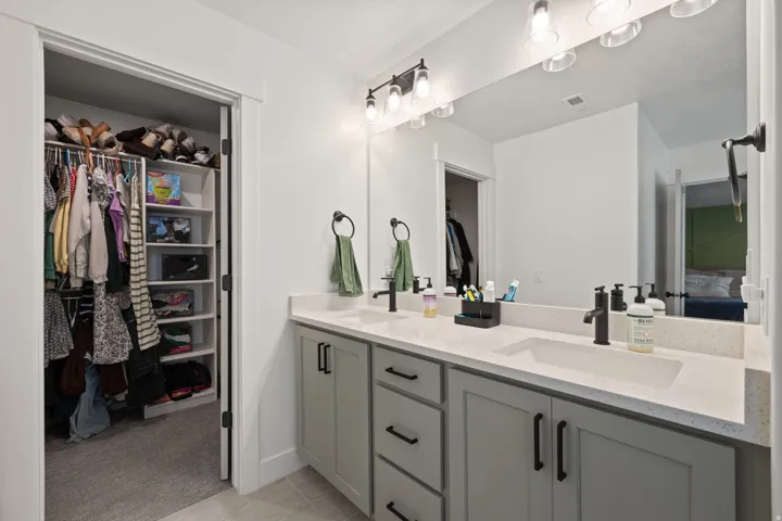 Double vanity with integrated sinks and a light-colored countertop