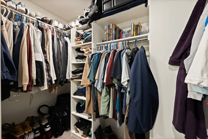 Built-in closet shelving, hanging rods, and integrated storage