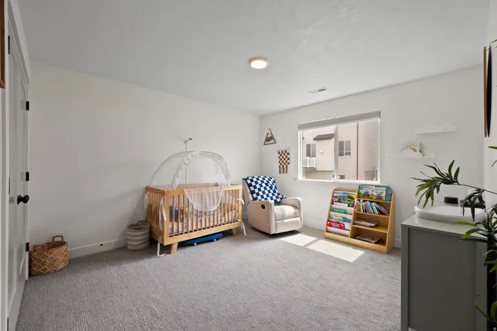 Wall-to-wall carpeting and a recessed ceiling light
