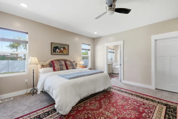 Recessed lighting, ceiling fan, and carpeted flooring