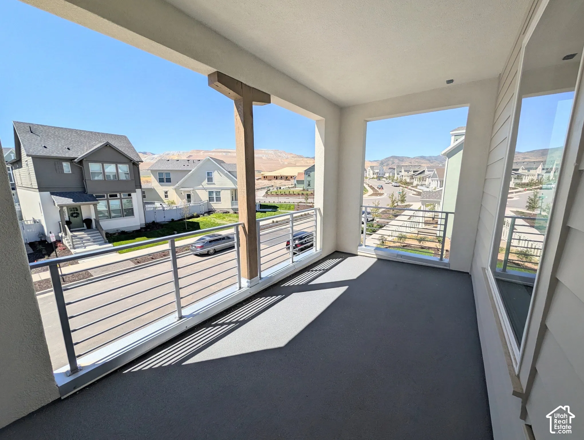 Covered outdoor balcony off of Primary bedroom