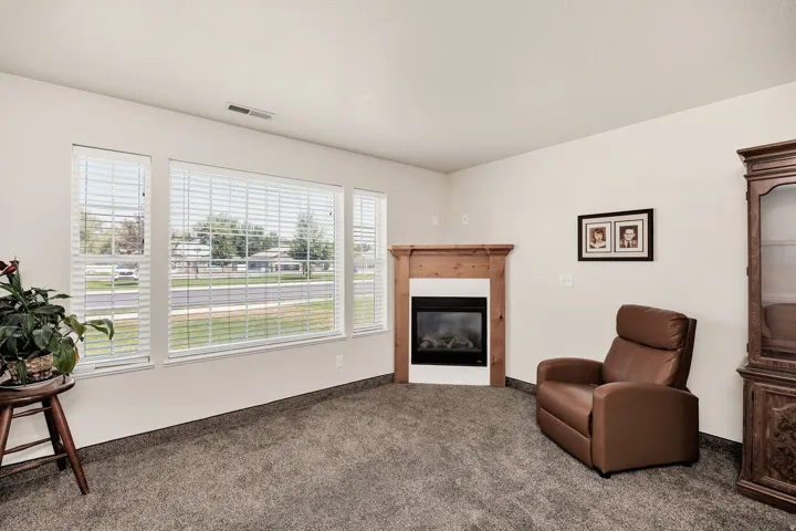 Corner fireplace , complemented by a large window ensemble