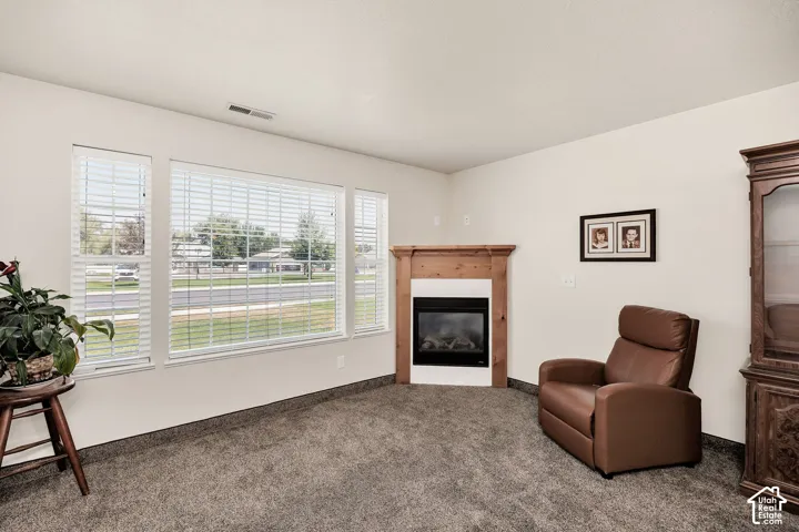 Corner fireplace , complemented by a large window ensemble