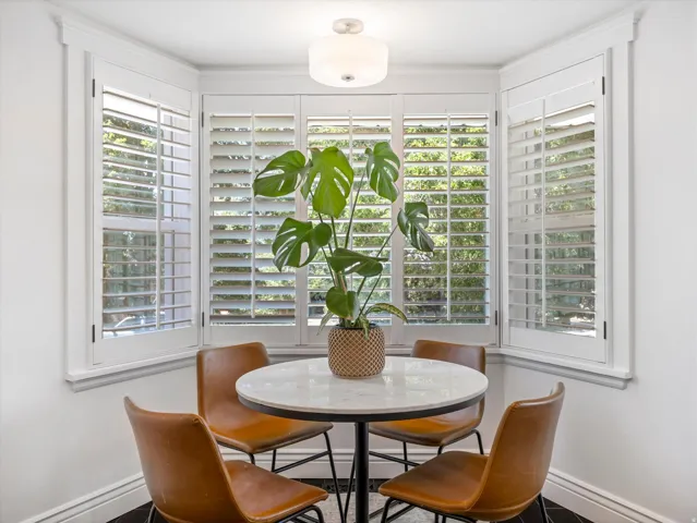 Bay window with plantation shutters and white trim