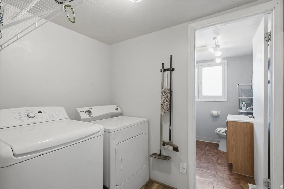 Dedicated laundry area featuring wire shelving