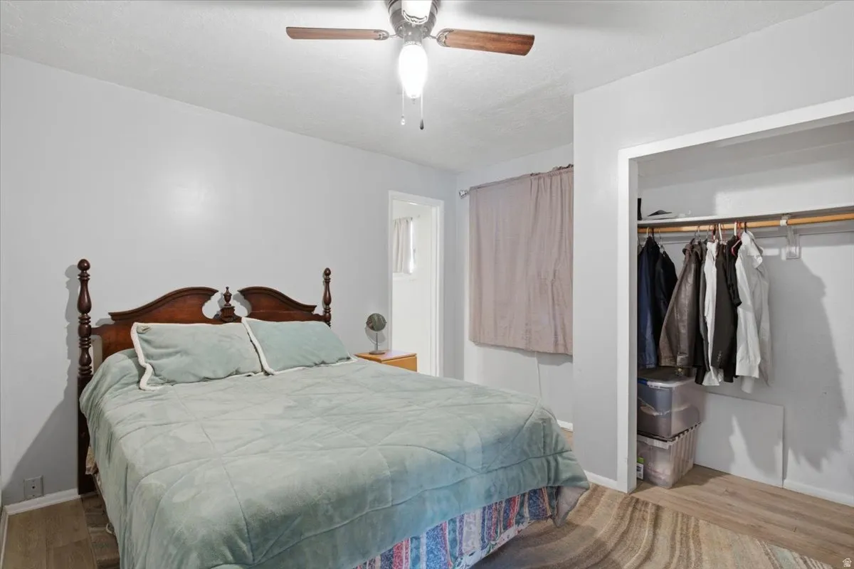 Light-toned walls complement wood-finish flooring in this room