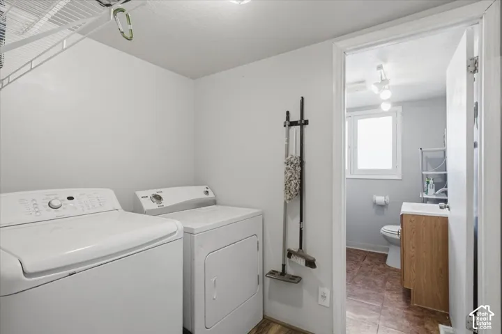 Dedicated laundry area featuring wire shelving