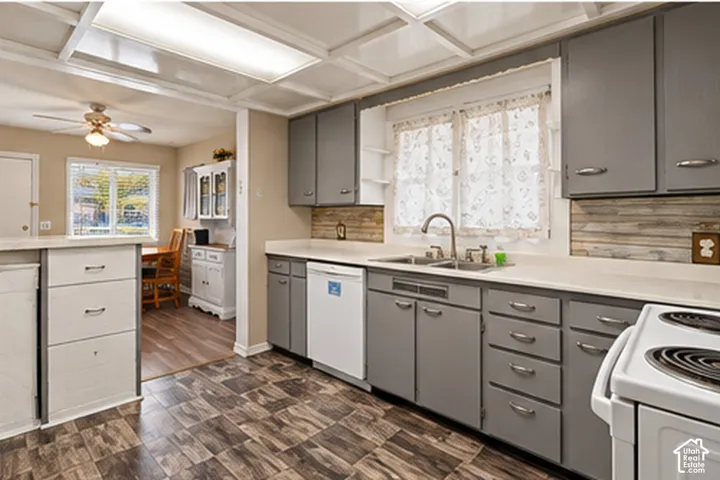 Kitchen featuring wood-look flooring and gray cabinetry with silver hardware