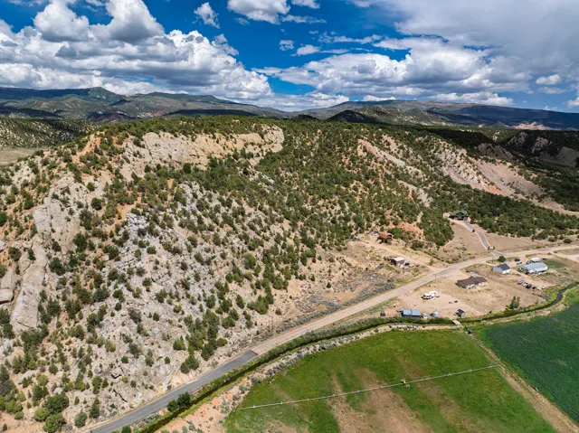 Mountainous terrain with natural rock formations and abundant evergreen foliage