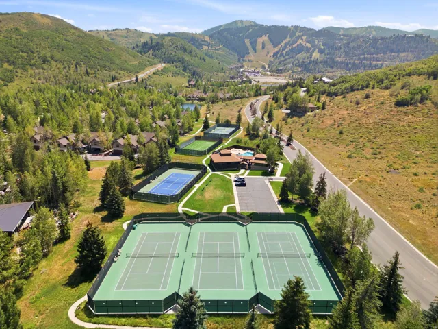Three fenced tennis courts, two additional fenced tennis courts, and a community clubhouse with outdoor pool