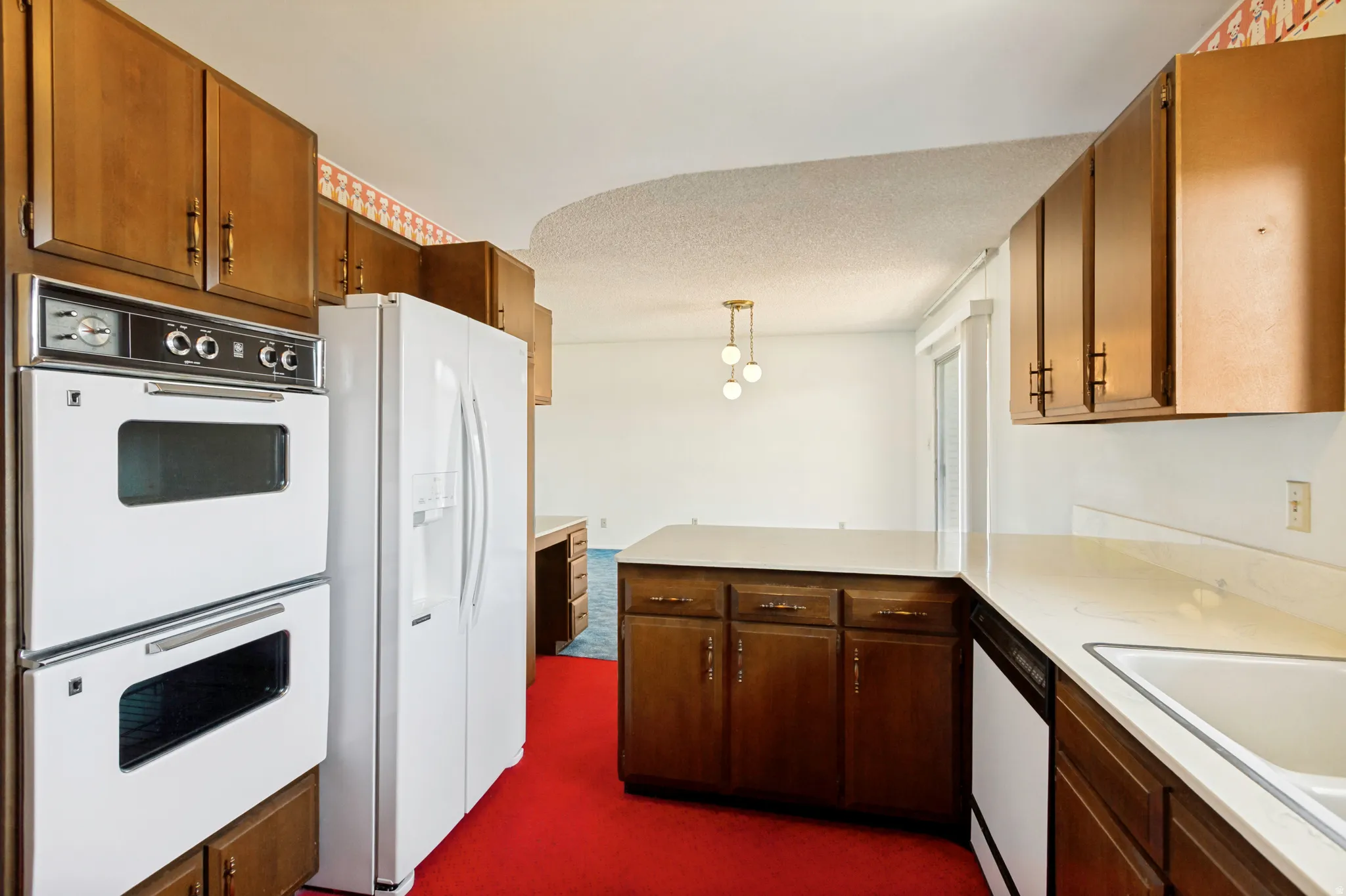 Double Ovens, Fridge Included.