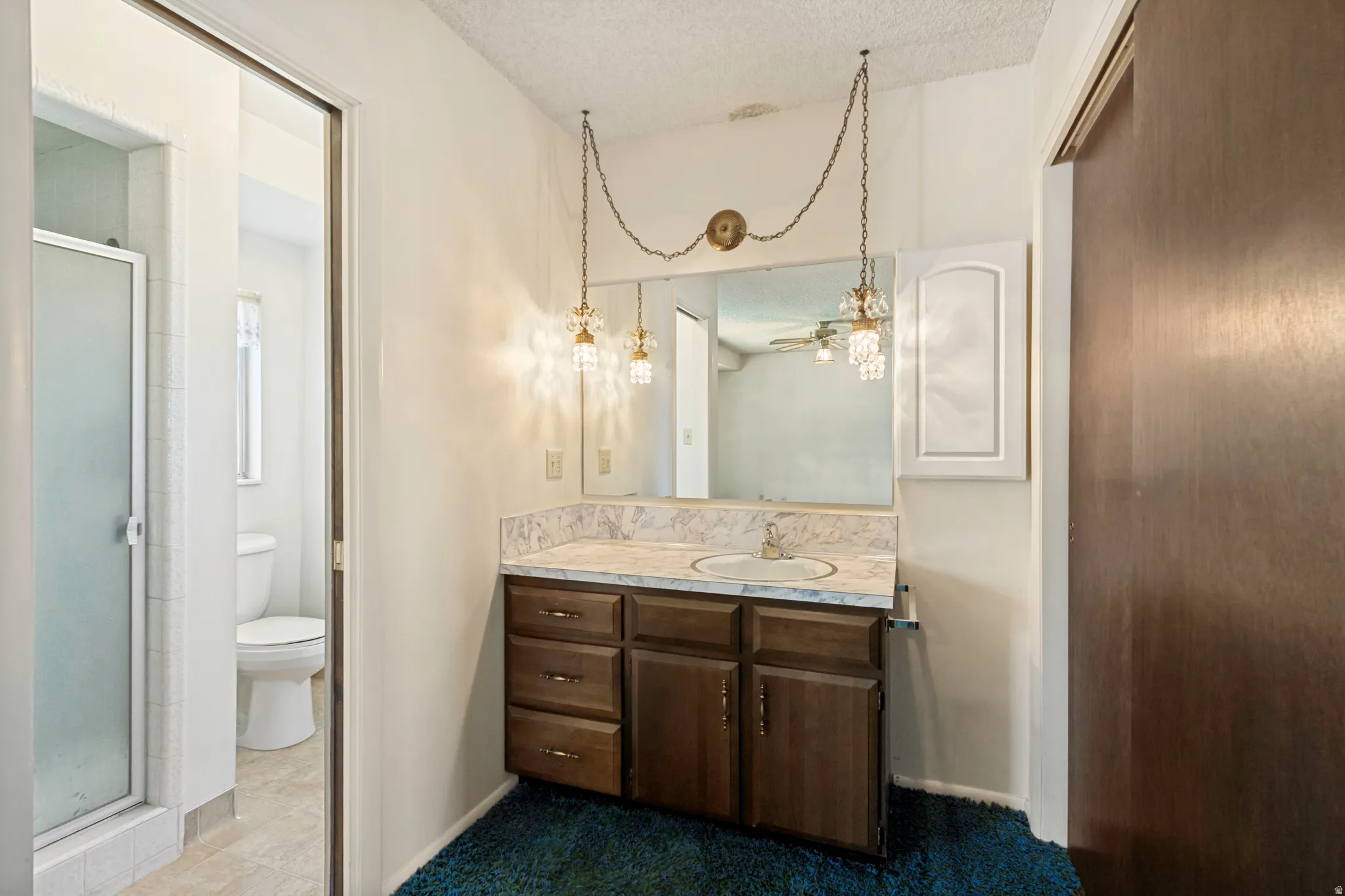 Primary Bedroom Private 3/4 bathroom with walk in shower.