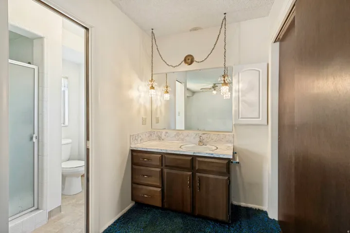 Primary Bedroom Private 3/4 bathroom with walk in shower.