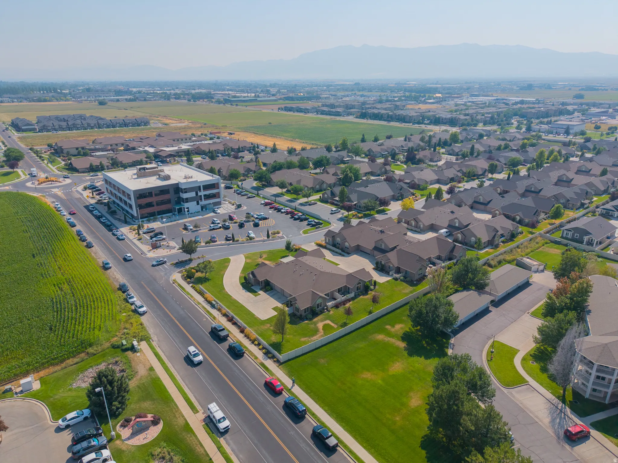 Aerial perspective showcasing a mixed-use neighborhood with commercial and residential properties
