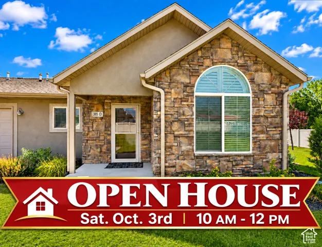 Stone veneer and stucco exterior with a prominent arched window