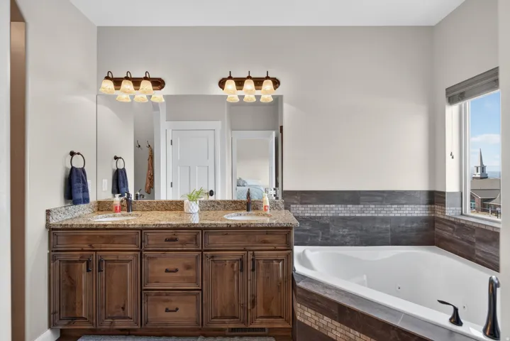 Dual vanity with granite countertop and undermount sinks