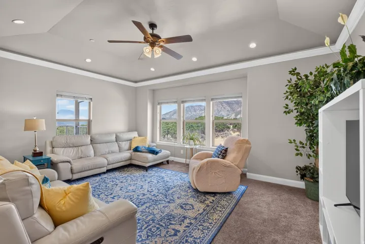 Tray ceiling with recessed lighting and crown molding