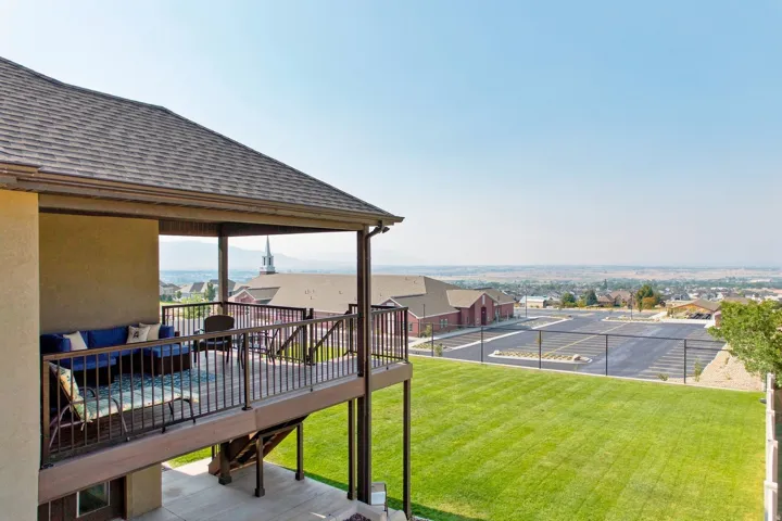 Covered outdoor deck with a dark railing system