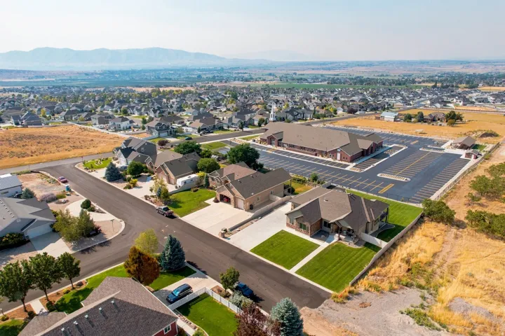 Suburban residential neighborhood with paved streets and manicured lawns