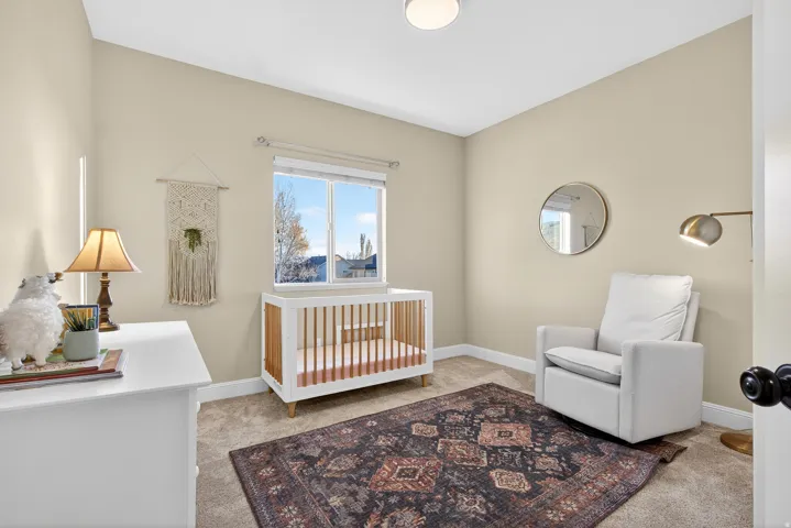 Carpeted room with neutral wall tones