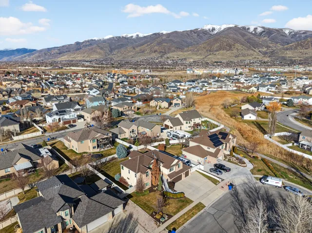 Expansive neighborhood setting with residential homes and distant snow-capped mountains
