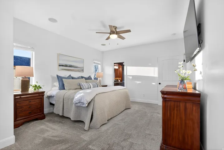 Vaulted ceilings with recessed lighting, ceiling fan, and carpeted flooring