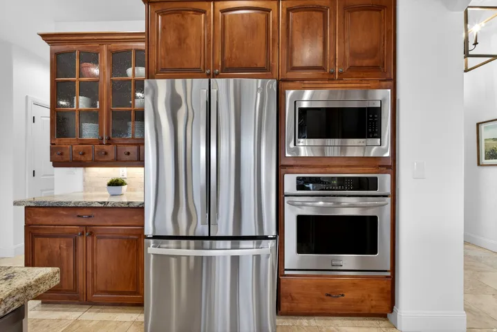Stainless steel French door refrigerator, built-in microwave, and wall oven