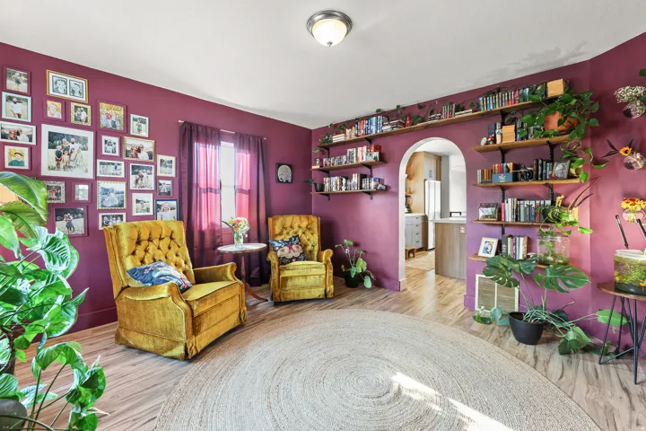 Wood-finish flooring with a rounded area rug