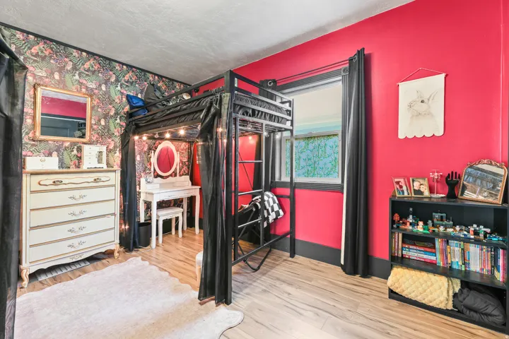 Wood-finish flooring with a multi-colored accent wall