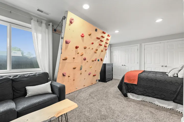 Recessed lighting, carpeted flooring, and a large window
