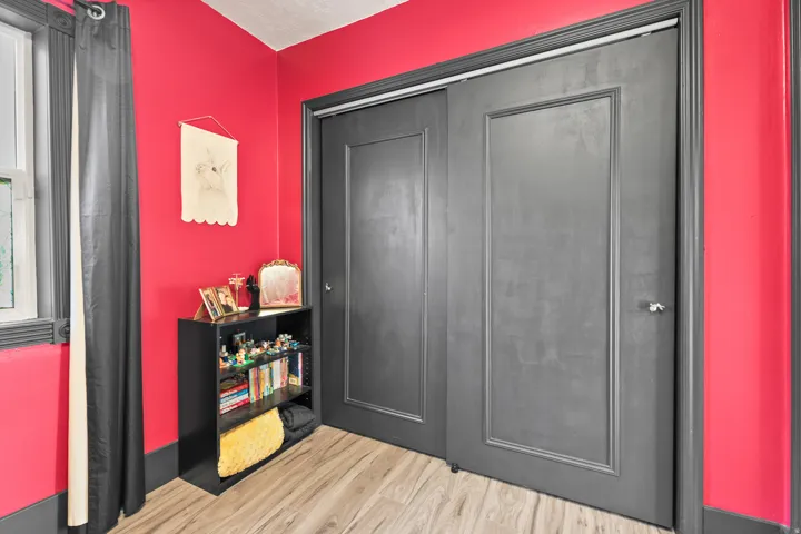 Wood-finish flooring with a vibrant wall color