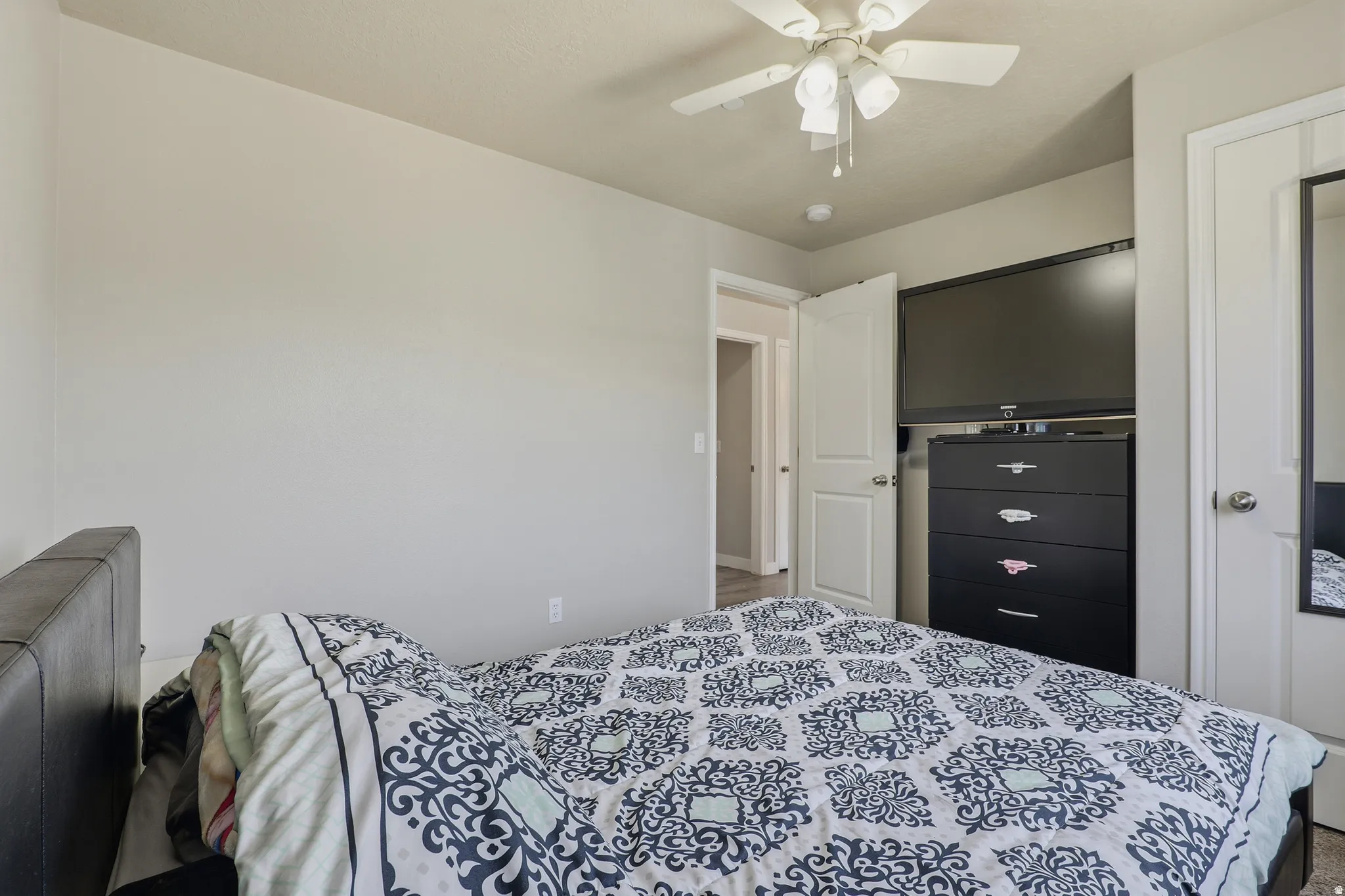Recessed ceiling fan, light-toned walls, and white trim throughout