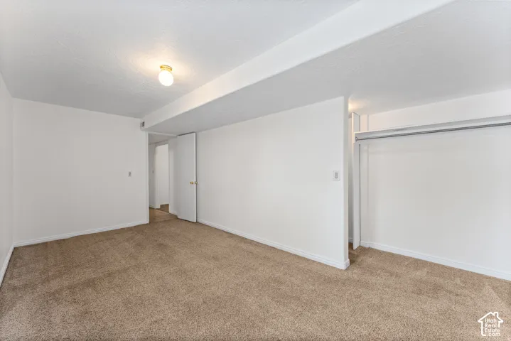 Neutral-toned carpeting throughout