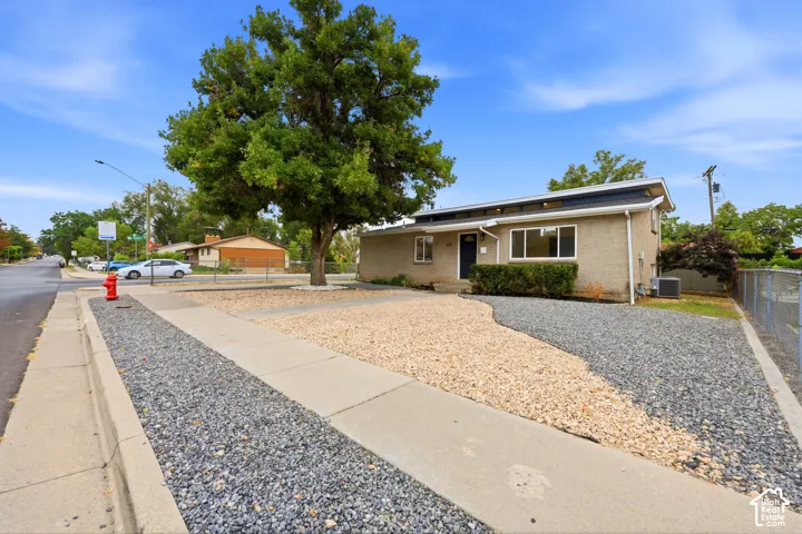 Stucco exterior with a dark trim roofline