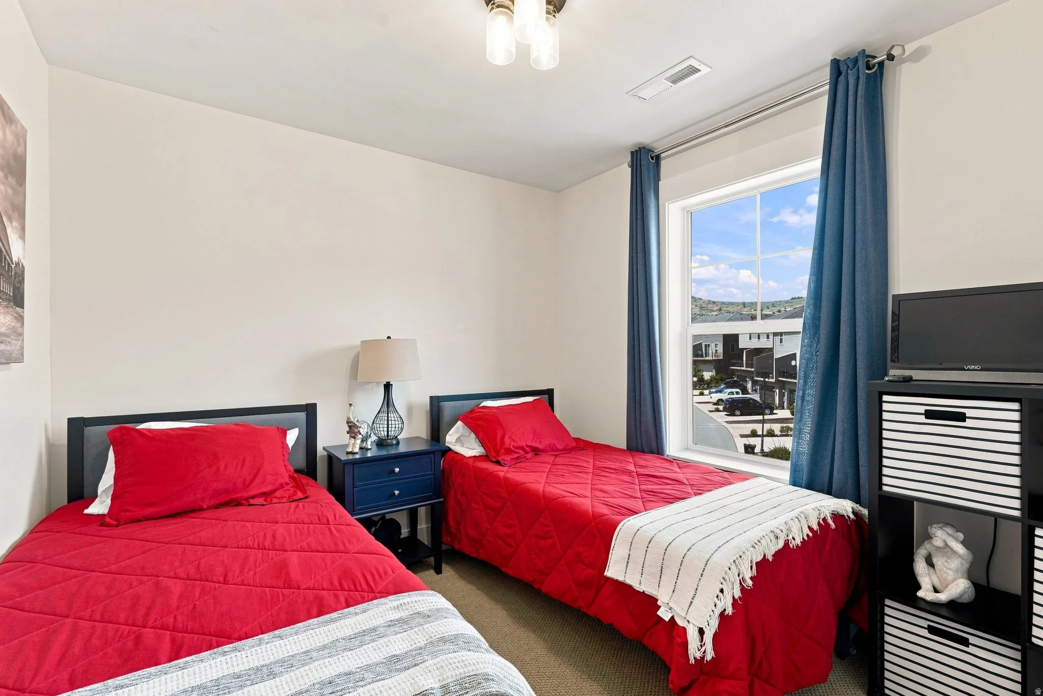 Ceiling-mounted light fixture, recessed window, and neutral wall tones
