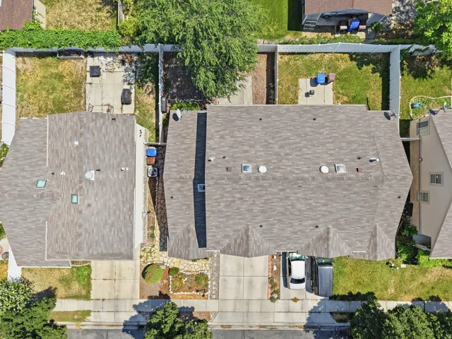 Asphalt shingle roof with multiple skylights