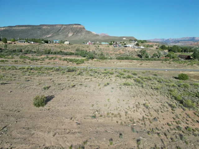 Expansive desert landscape with a distant mountain backdrop