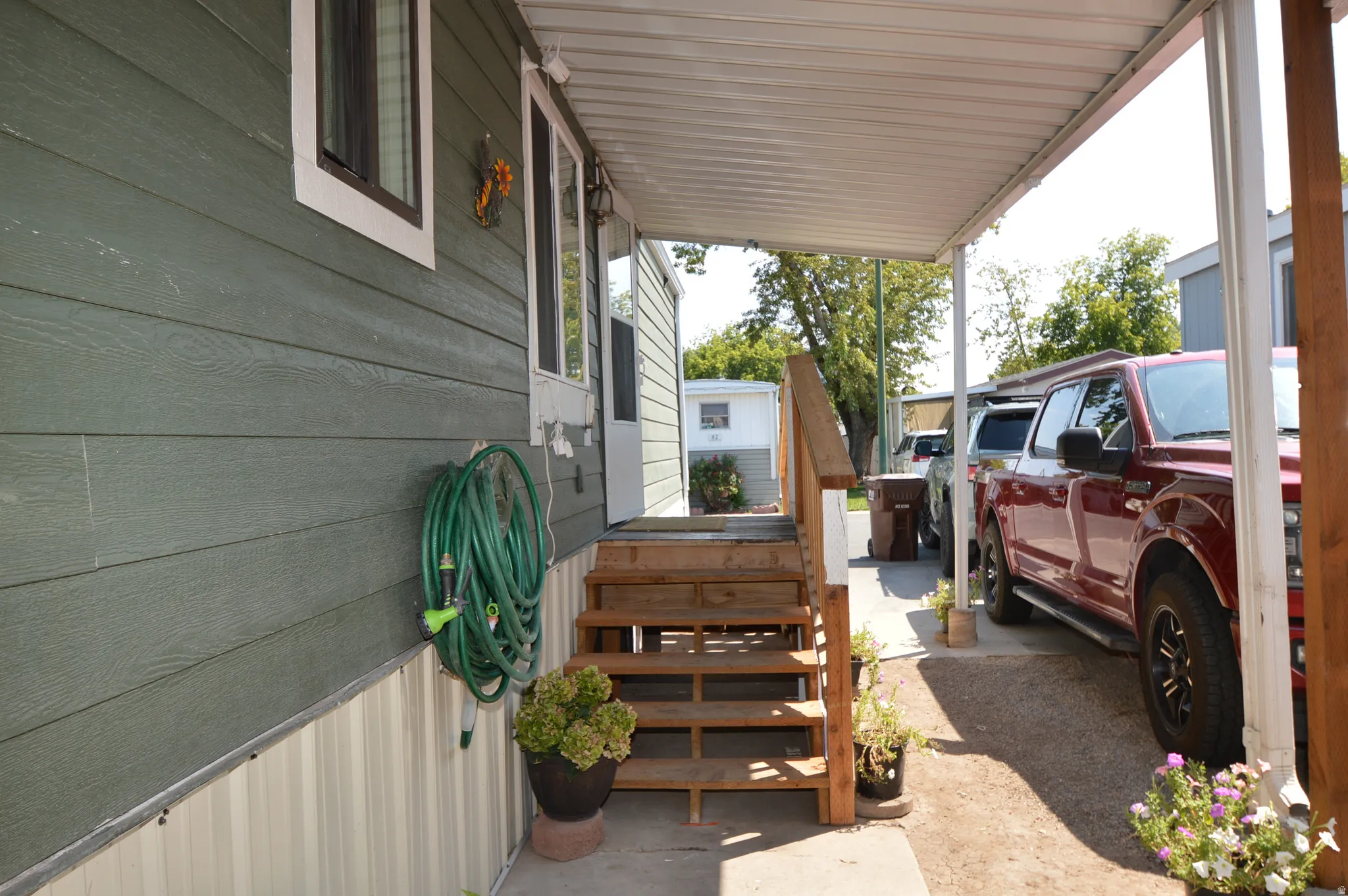 Covered carport with solid roof