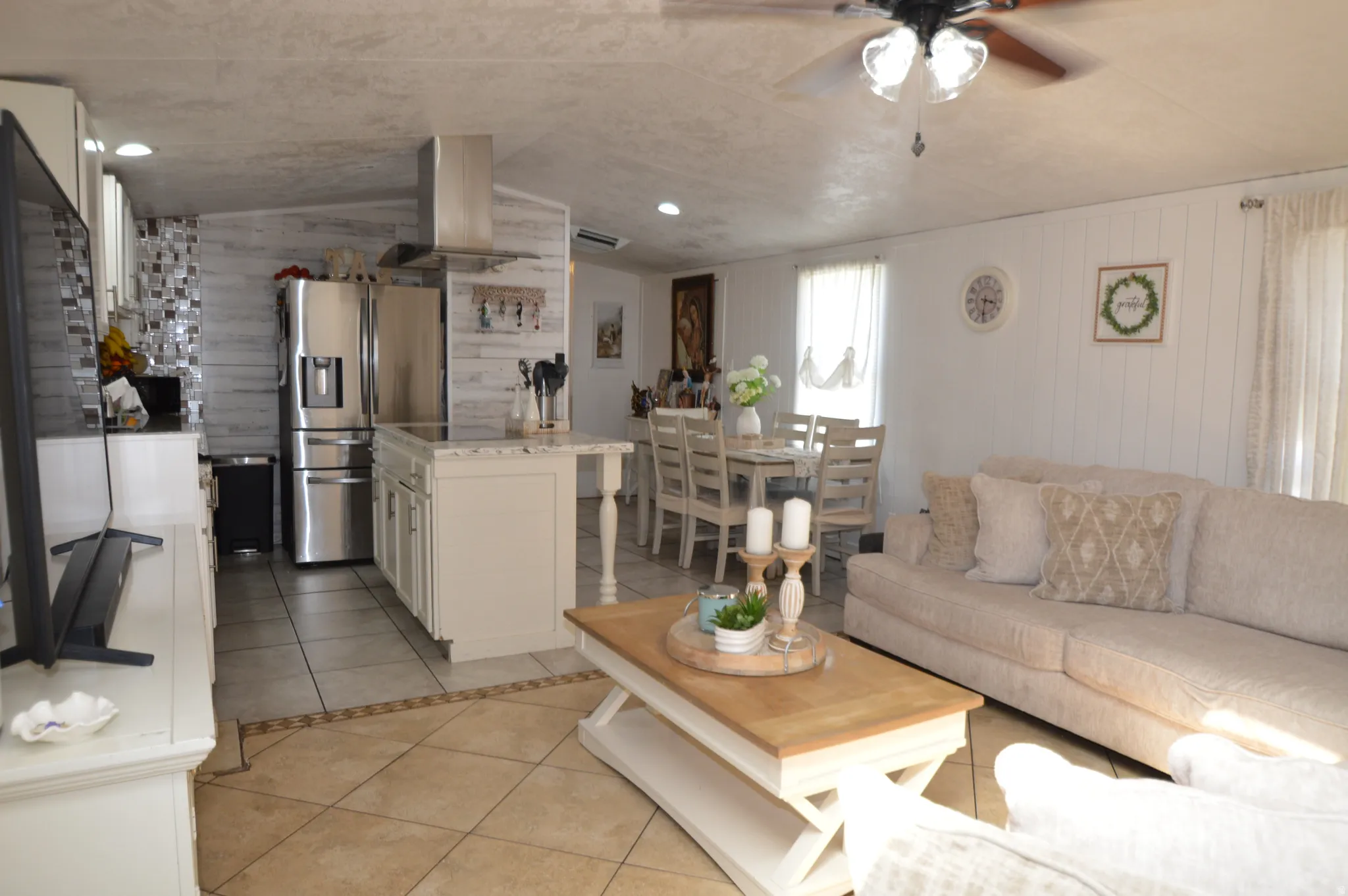 Open-concept living space with tile flooring