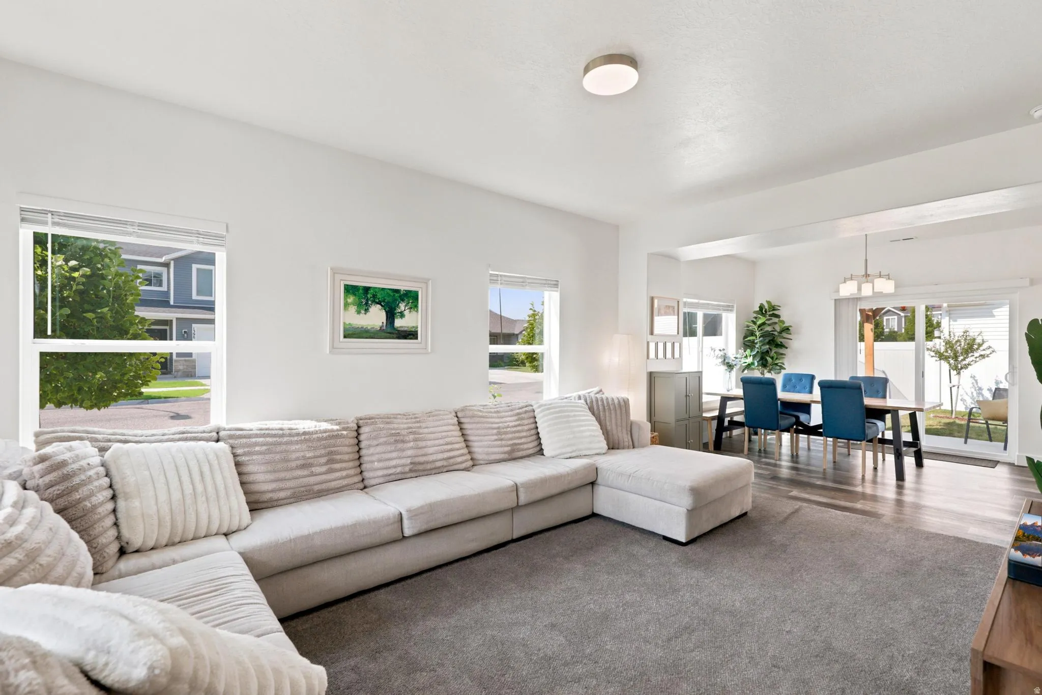 Open-concept living area featuring a neutral color palette