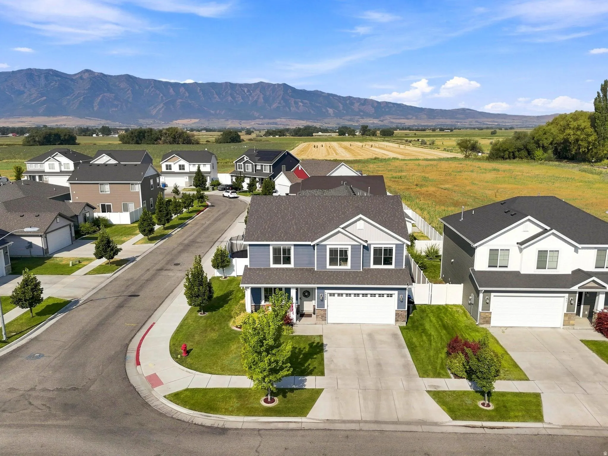 Two-story residence with a gray exterior and white trim