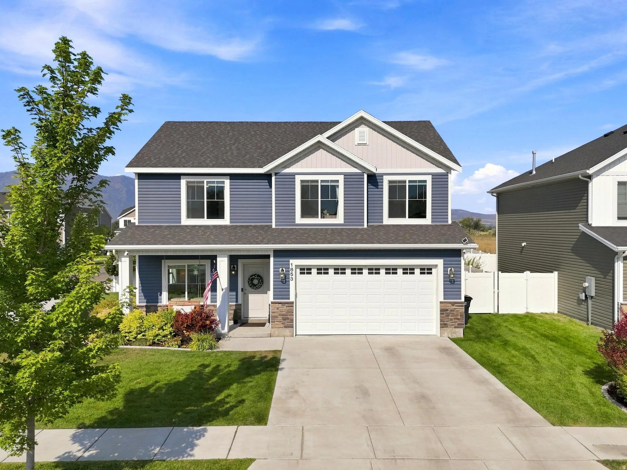 Two-story exterior with blue siding and white trim