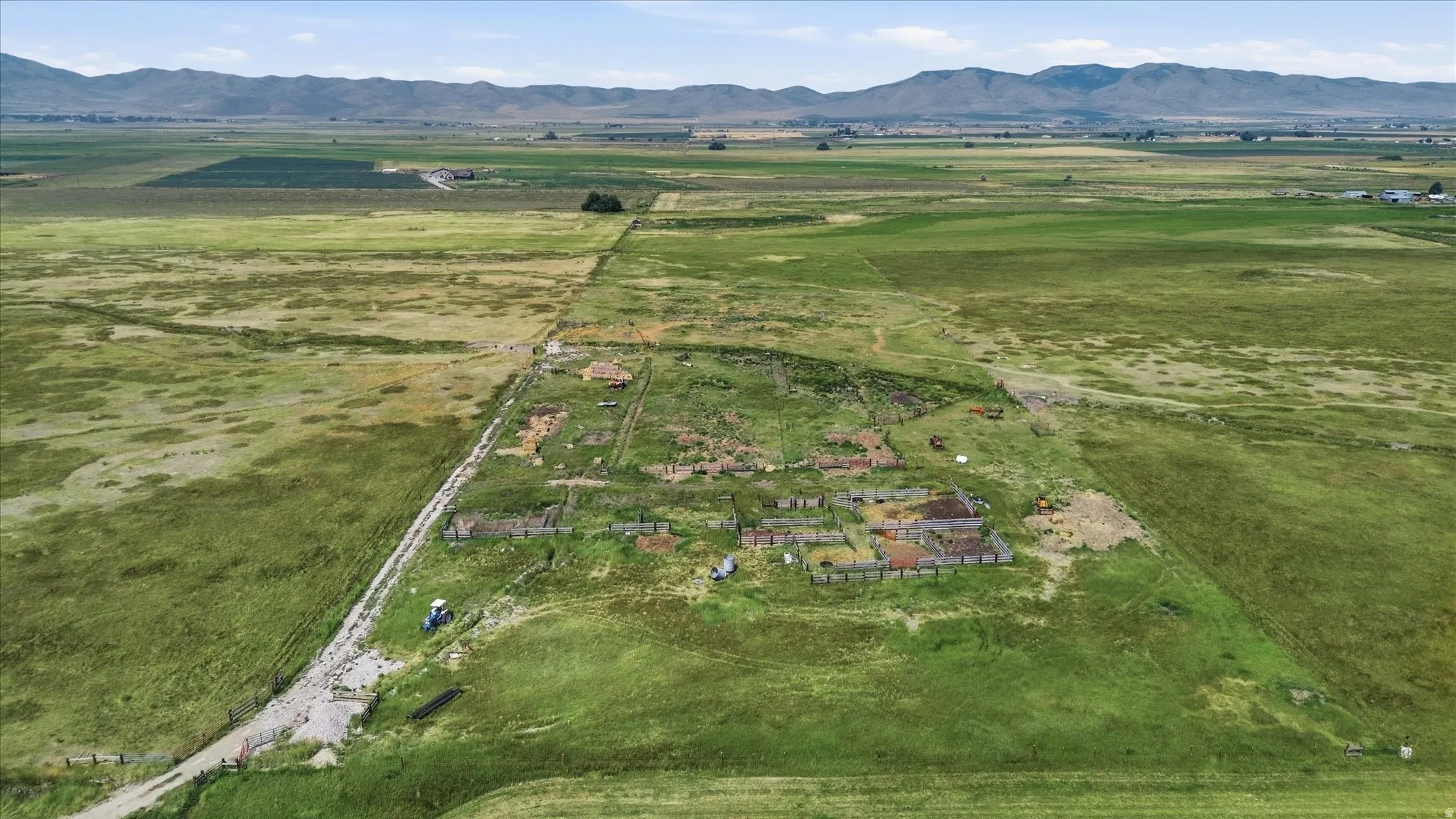 Expansive green landscape with distant mountains