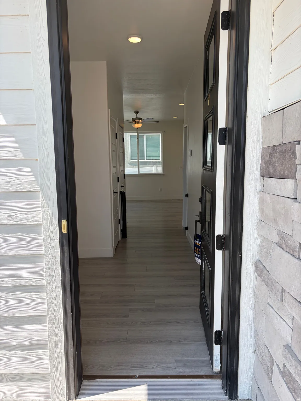 Entryway featuring wood-finish flooring, recessed lighting, and a modern ceiling fan