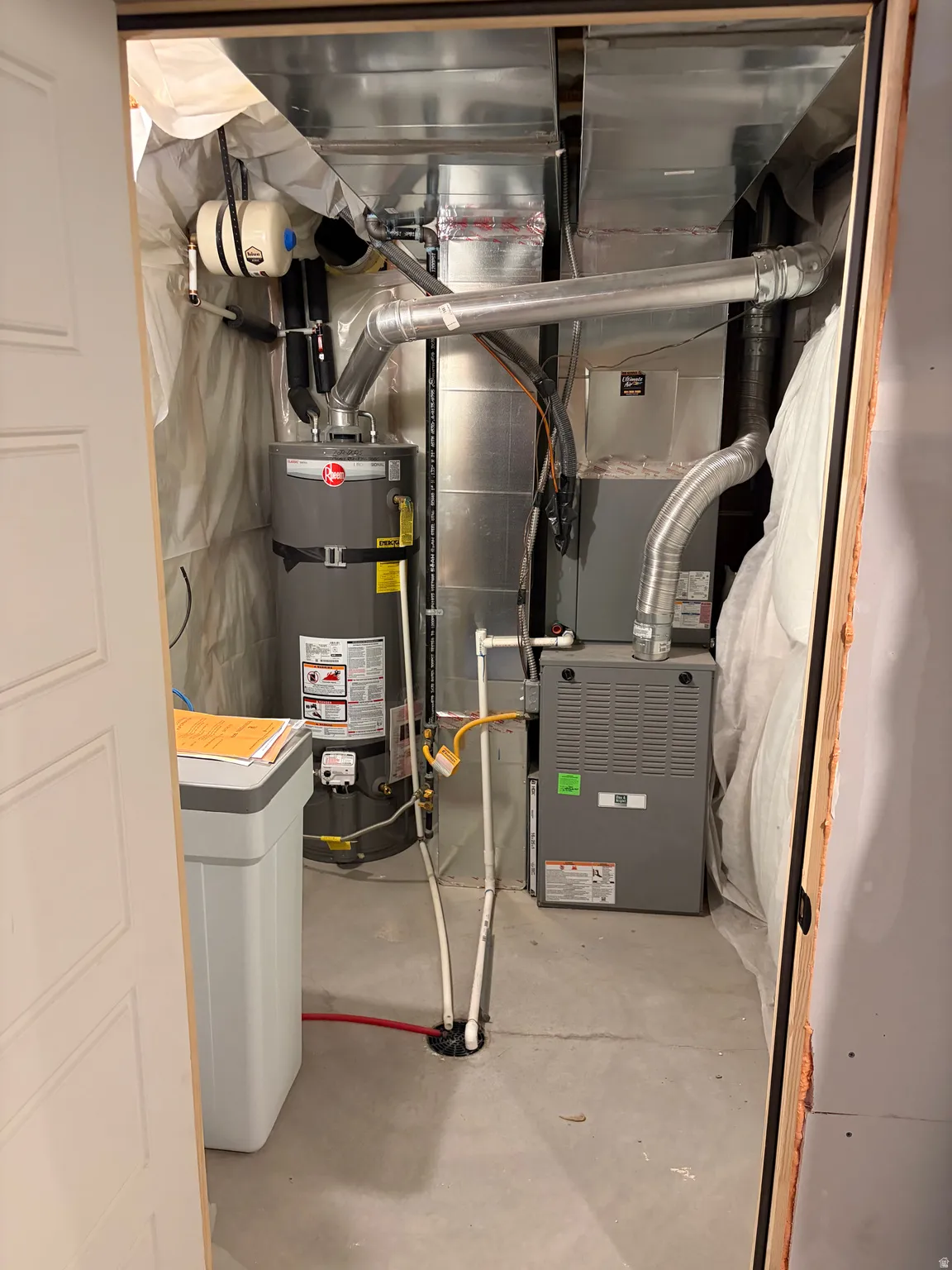 Water heater, water softener, and HVAC system with ductwork