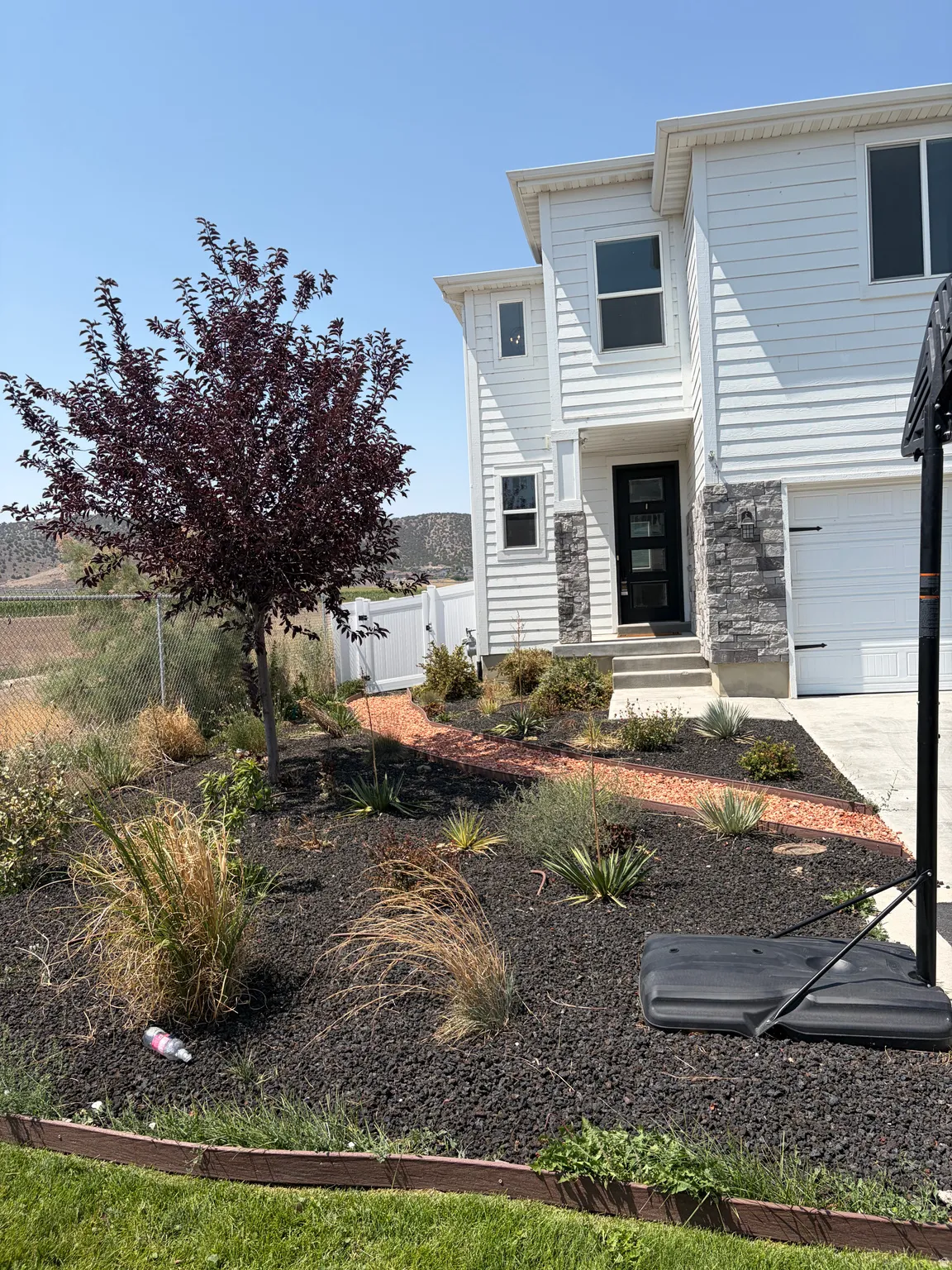 White siding exterior with stone accents