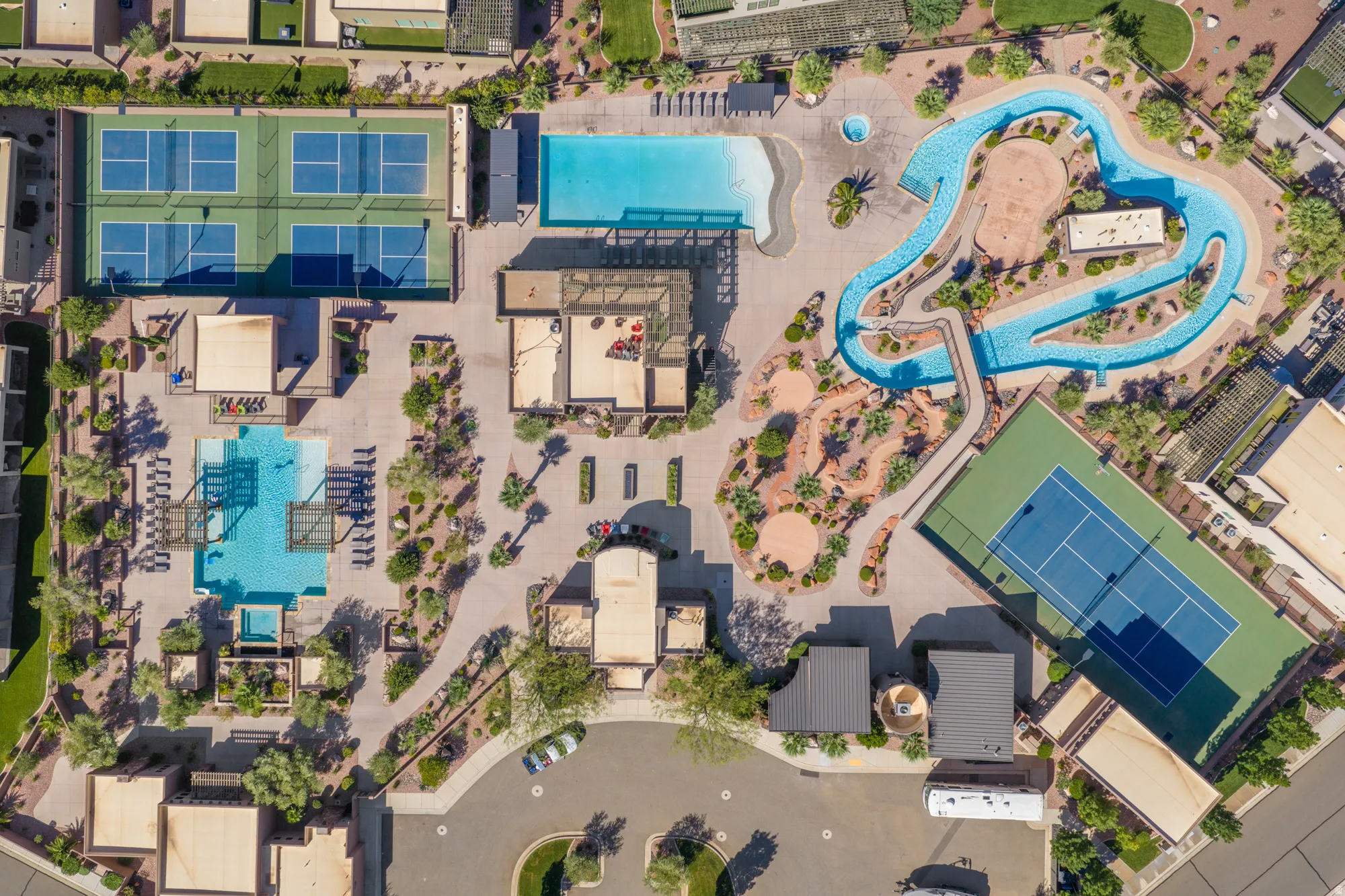 Community amenities featuring a resort-style pool, a lazy river, multiple tennis courts, and additional recreational courts