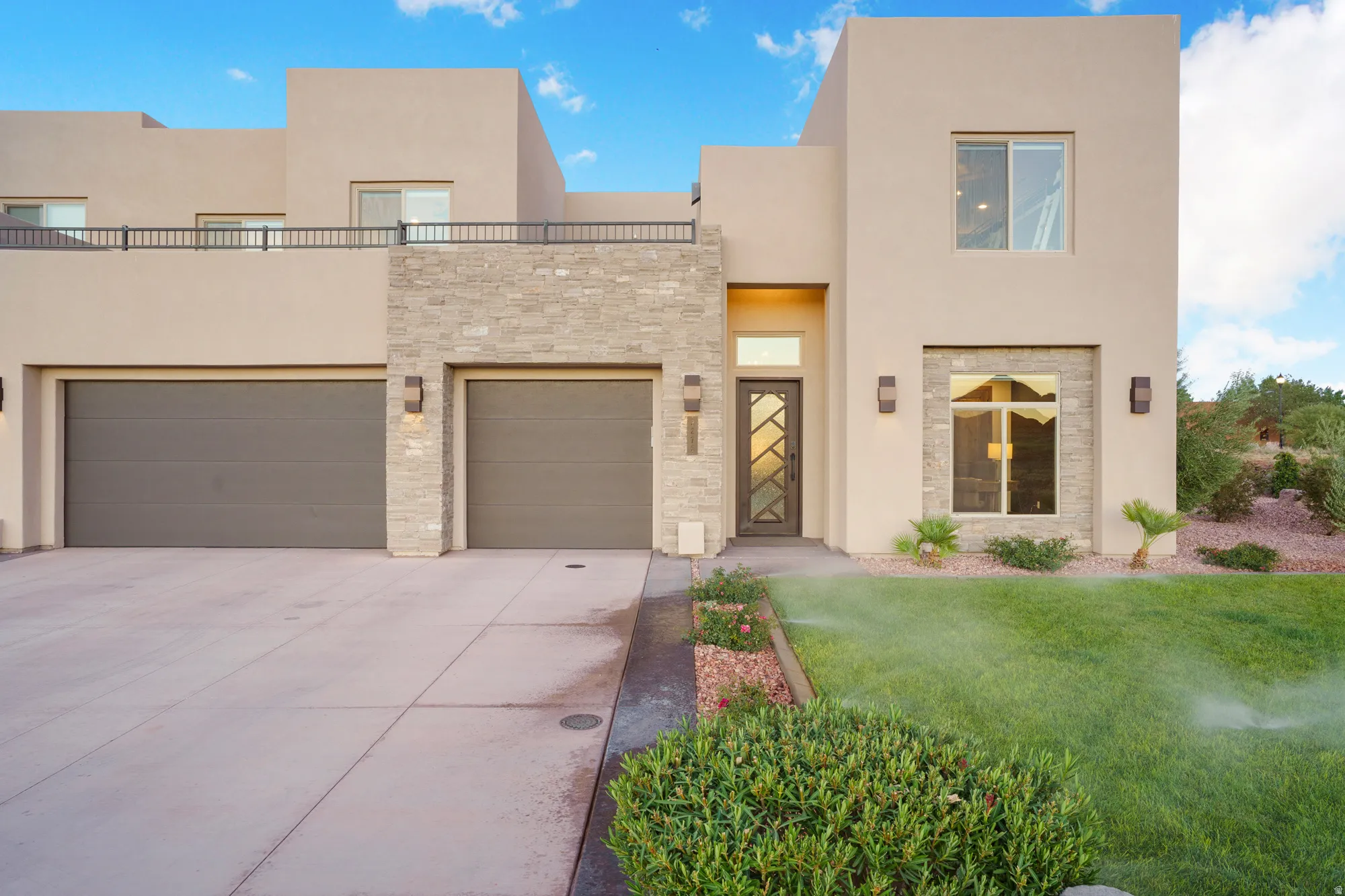 Contemporary stucco exterior with stone accents